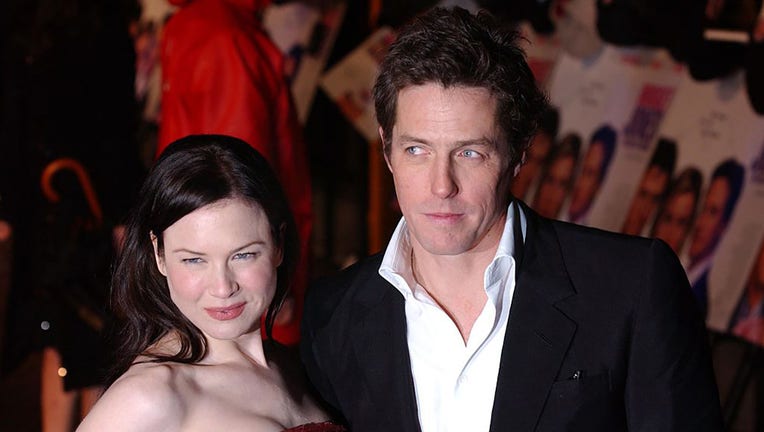 FILE - Co-stars Hugh Grant and Renee Zellweger attend the premiere of "Bridget Jones: The Edge of Reason" at the Odeon, Leicester Square. (Photo by rune hellestad/Corbis via Getty Images)