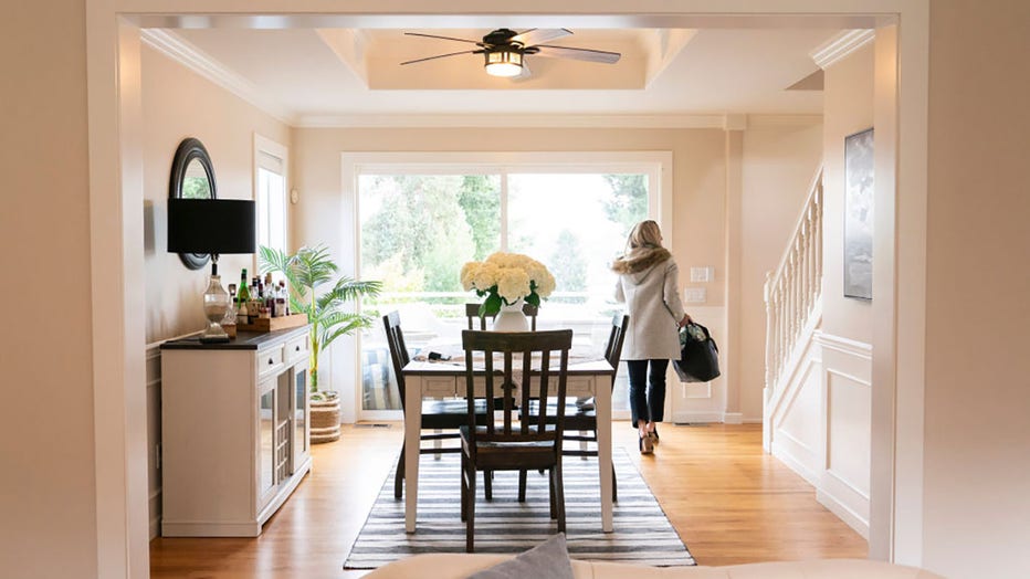 FILE - A realtor walks through the dining room during an open house at a home in Seattle, Washington, US, on Tuesday, March 26, 2024. Photographer: David Ryder/Bloomberg via Getty Images