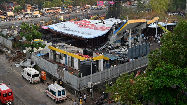 Billboard collapses onto group of pedestrians, killing at least 14