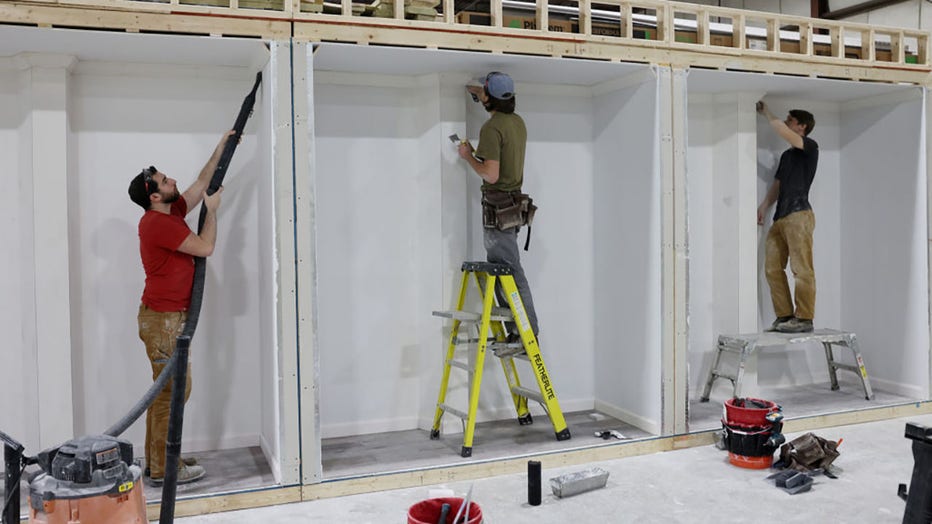 FILE - Apprentices learn how to plaster inside Forge, a trade school that is combining training in the trades with new technology, and a guaranteed job upon graduation. (Photo by Jessica Rinaldi/The Boston Globe via Getty Images)