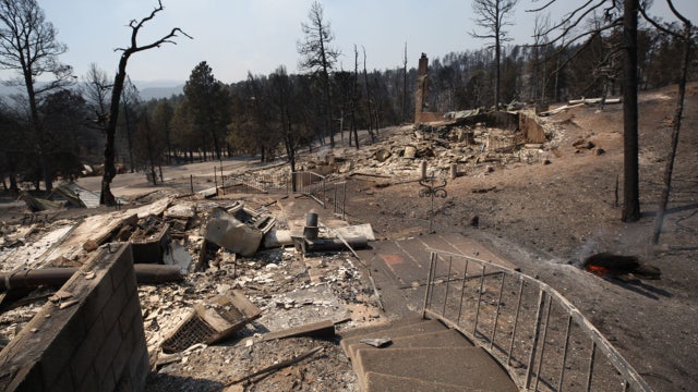 At least 2 dead, over 1,400 structures burned as New Mexico wildfires rage