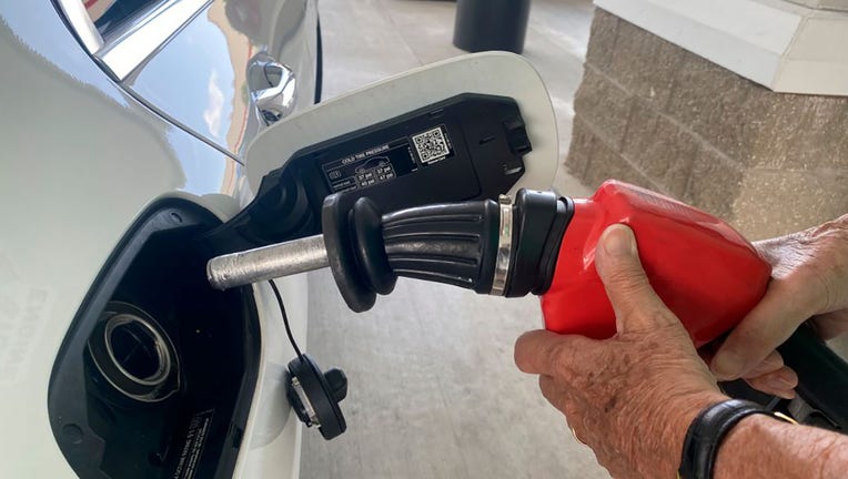 FILE - Close up of man filling up gas tank at Costco Kirkland gas station, West Palm Beach, Florida. (Photo by: Lindsey Nicholson/UCG/Universal Images Group via Getty Images)