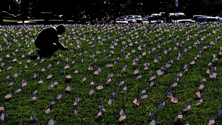 FILE - 5,520 American flags planted on a grassy area of the Mall, (14th street NW at Madison Drive NW) to represent a veteran or service member who died by suicide in 2018. (Photo by Michael S. Williamson/The Washington Post via Getty Images)