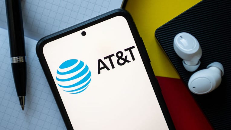 FILE - In this photo illustration, an AT&T logo is seen displayed on a smartphone. (Photo Illustration by Mateusz Slodkowski/SOPA Images/LightRocket via Getty Images)