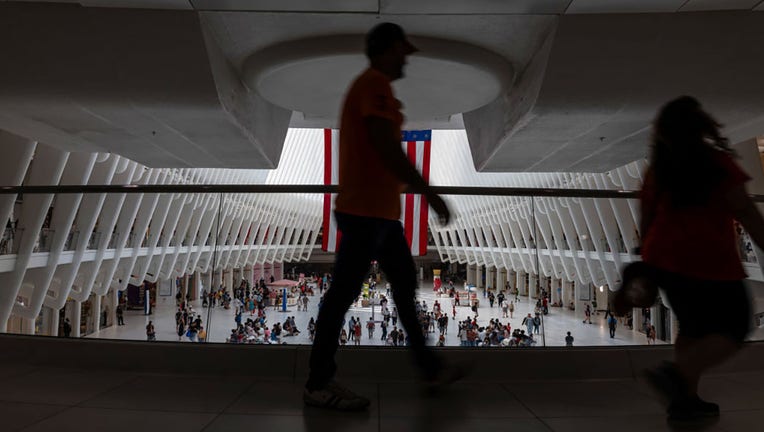 FILE - People walk through a Manhattan mall on July 5, 2024, in New York City. (Photo by Spencer Platt/Getty Images)