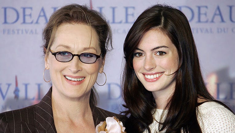 FILE - U.S. actresses Meryl Streep (L) and Anne Hathaway pose during a photocall of their film "The Devil Wears Prada" presented at the 32nd Deauville American film festival, on Sept. 9, 2006. (Photo: FRANCOIS GUILLOT/AFP via Getty Images)