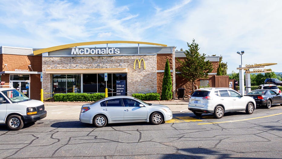 FILE - A McDonalds fast food restaurant with a line of cars at the drive thru ordering. (Photo by: Jeffrey Greenberg/Universal Images Group via Getty Images)