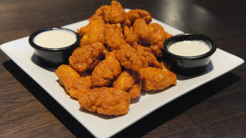 Plate of boneless chicken wings with dipping sauce