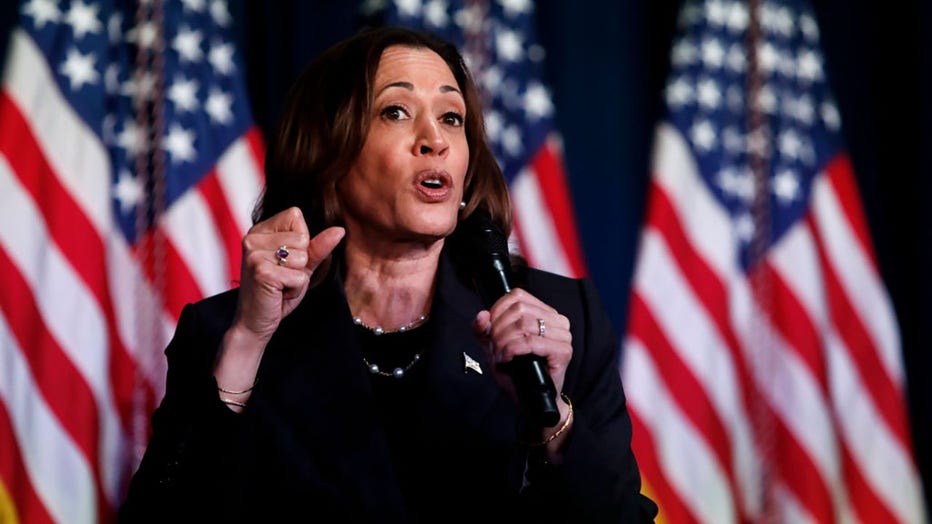 US Vice President Kamala Harris speaks at a moderated conversation with former Trump administration national security official Olivia Troye and former Republican voter Amanda Stratton on July 17, 2024, in Kalamazoo, Michigan. (Photo by Chris duMond/Getty Images)