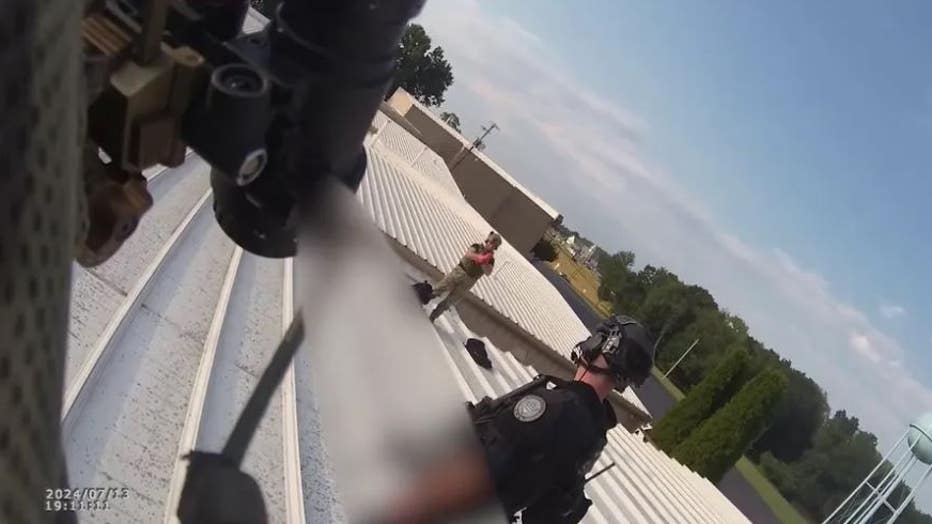 Law enforcement officers on a rooftop captured by bodycam footage, moments after neutralizing Thomas Crooks.