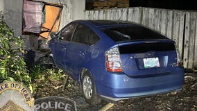 Man crashes car into apartment while eating chicken, talking on phone