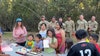 Soldiers pause to help girl celebrate 9th birthday during hurricane relief efforts