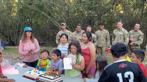 Soldiers pause to help girl celebrate 9th birthday during hurricane relief efforts