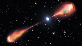 Telescopes spot monster radio jet streaming from ancient quasar