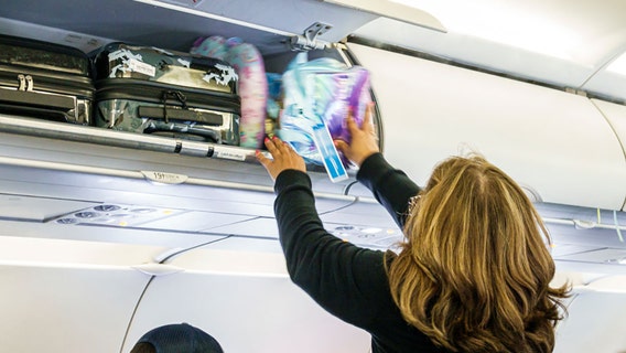 Flight passenger witnesses luggage buckled into 1st-class seat, igniting social media debate