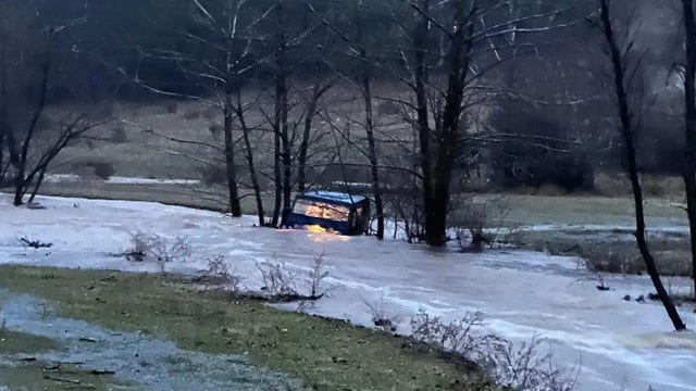 Driver swept into floodwaters rescued by 3 linemen restoring power in Virginia