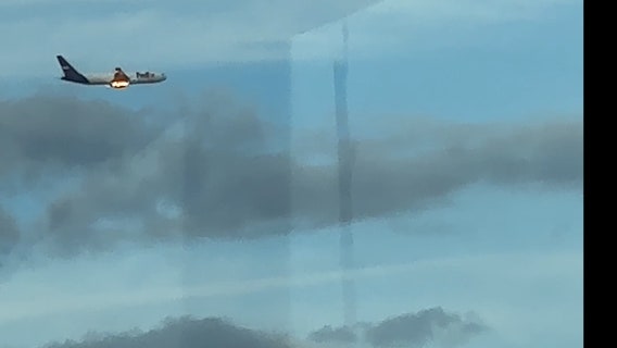 FedEx plane seen flying while on fire near Newark Airport