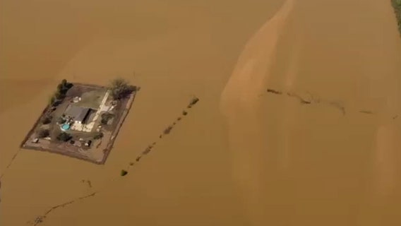 Tennessee family builds levee to protect home from floodwaters