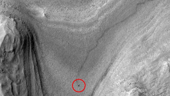 NASA’s Curiosity rover spotted from space making tracks on Mars’ surface