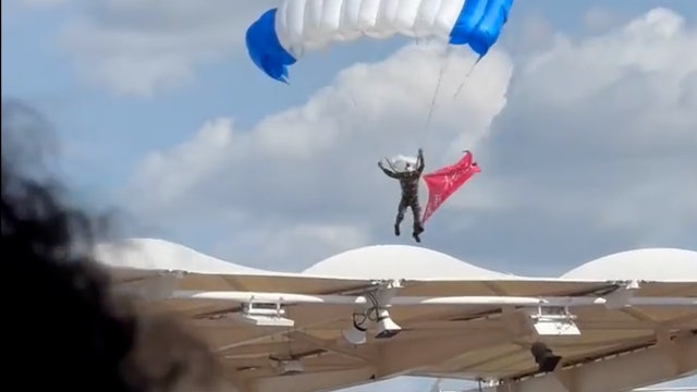 Parachutist left dangling from stadium roof as pregame stunt goes wrong