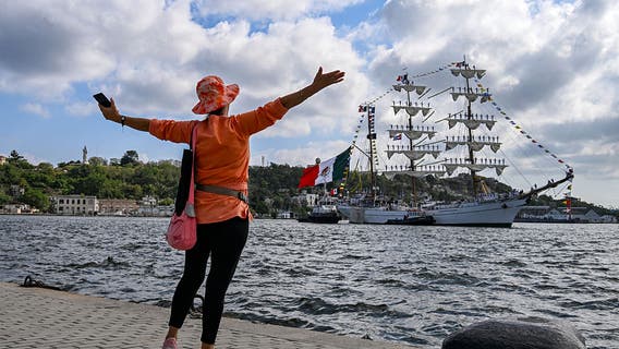 Yes, those were sailors standing on the Mexican tall ship's masts