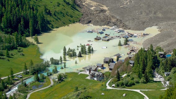 Alpine village submerged in brown sludge after glacier collapse