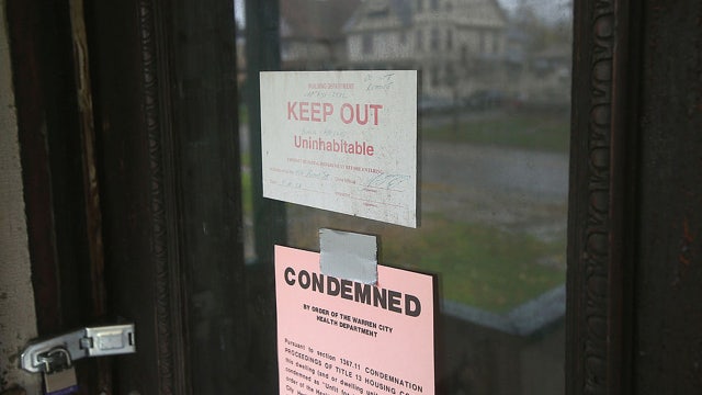 Woman lived in home with dead son for 9 months, police say