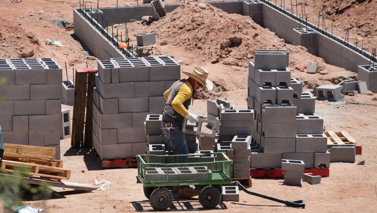 Construction workers building a foundation