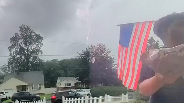 Watch: Delivery driver has close call after lightning strikes near New Jersey home