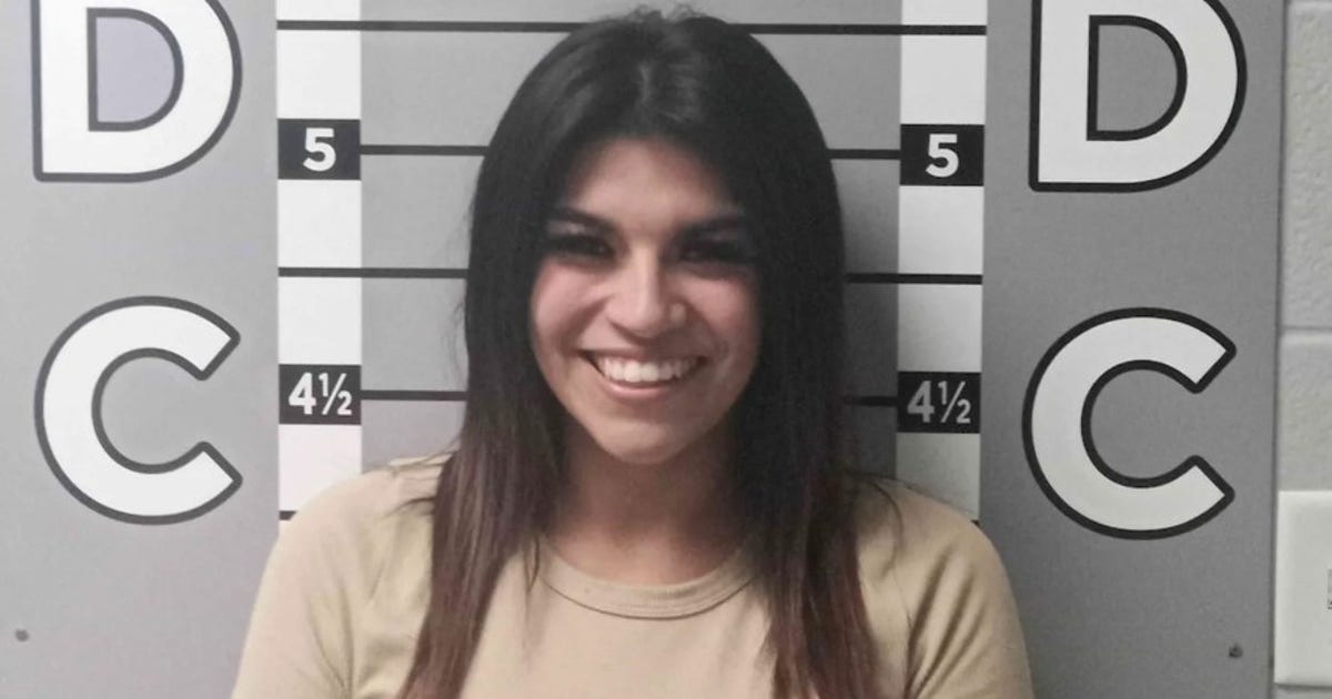 Woman's smiling mugshot goes viral after alleged $12K car