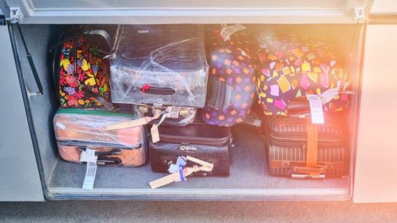 Woman arrested after bus driver finds toddler in suitcase