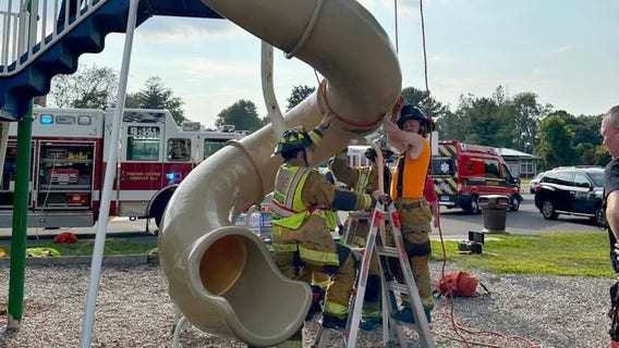 Firefighters cut open playground slide to rescue 40-year-old man stuck inside