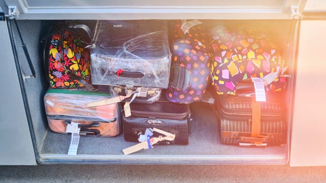 Woman arrested after bus driver finds toddler in suitcase