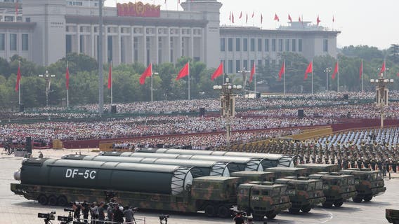 China’s military parade shows off new missiles, drones