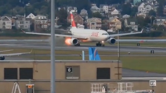 Passenger jet aborts Boston takeoff after flame and smoke spew from engine