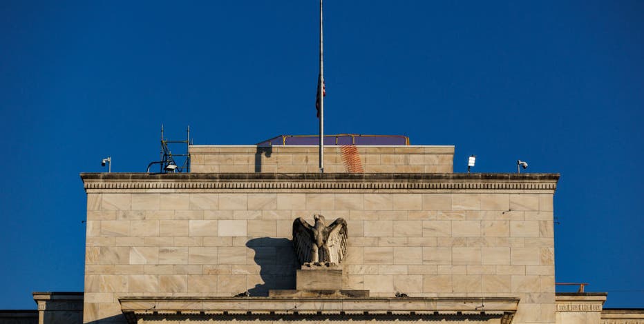 Fed cuts key interest rate, signals two more this year