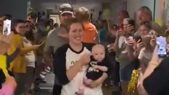 Watch: Nebraska baby born with rare cancer leaves hospital to cheers after months of treatment