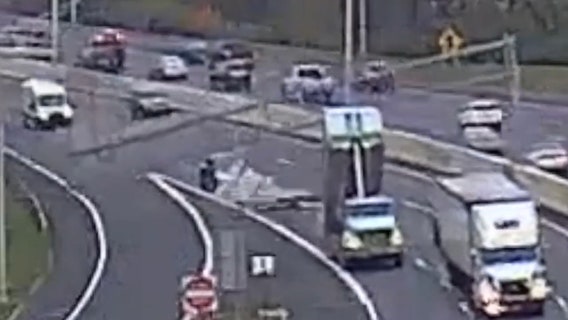Watch: Dump truck slams into overhead highway sign in Ohio