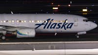 'We’re all going to die': Alaska Airlines passenger accused of trying to open cabin door midflight