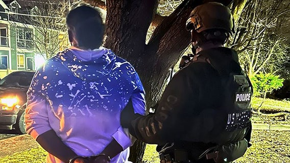 Fugitive hides under bed before US Marshals take him into custody