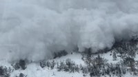 Video shows terrifying moment when avalanche collides with moving train