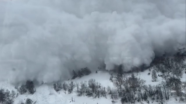 Video shows terrifying moment when avalanche collides with moving train