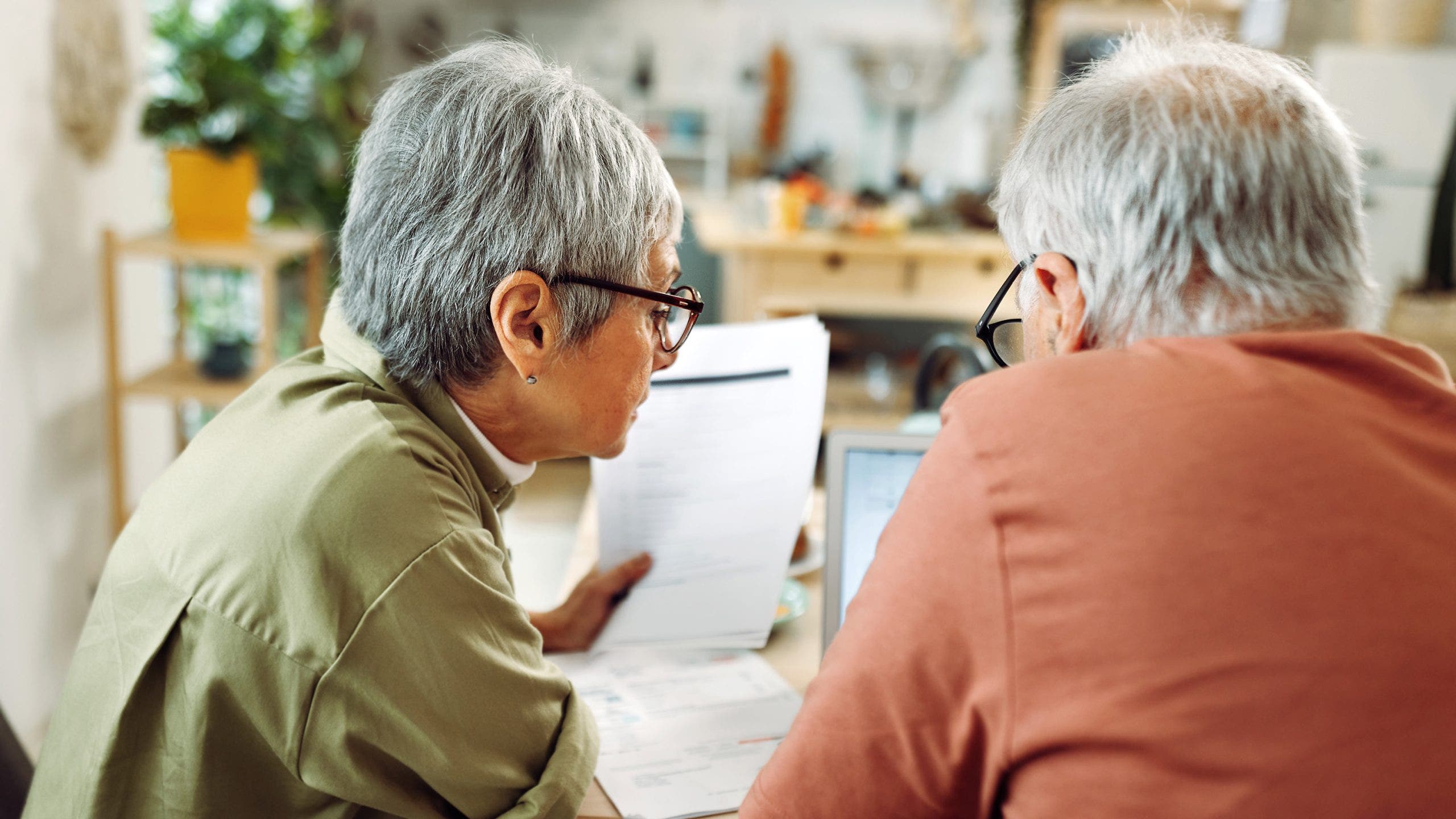 Americans tap retirement funds at record rates as mounting financial stress takes toll