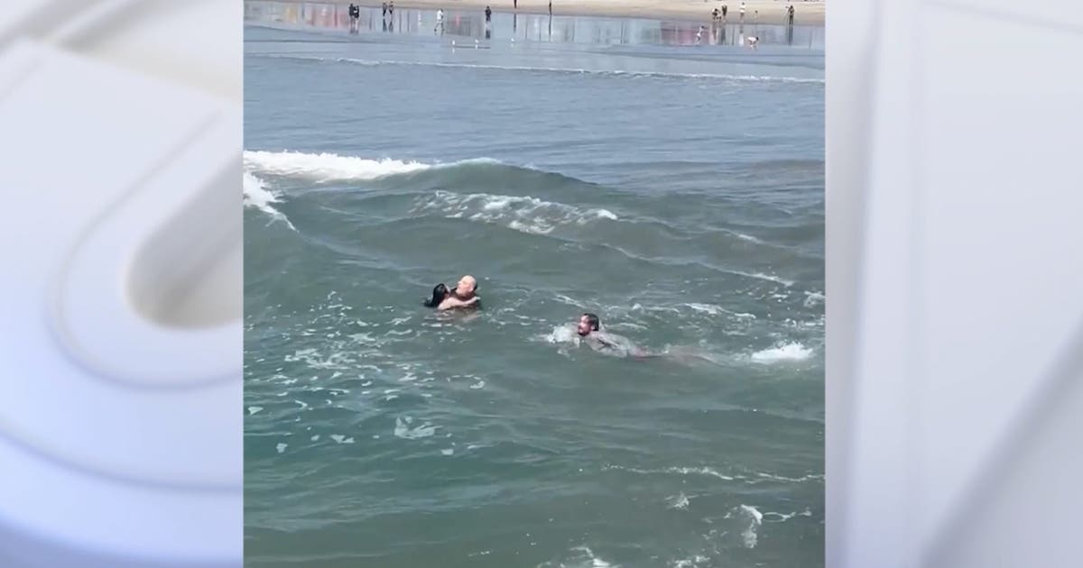 Watch: Surf coach saves father, daughter from rip current in California