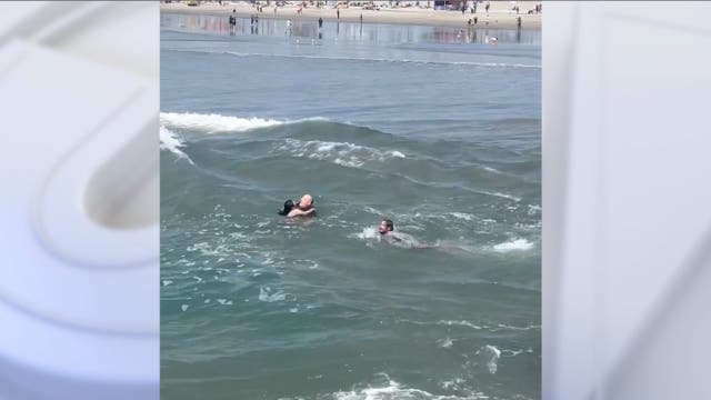 Watch: Surf coach saves father, daughter from rip current in California