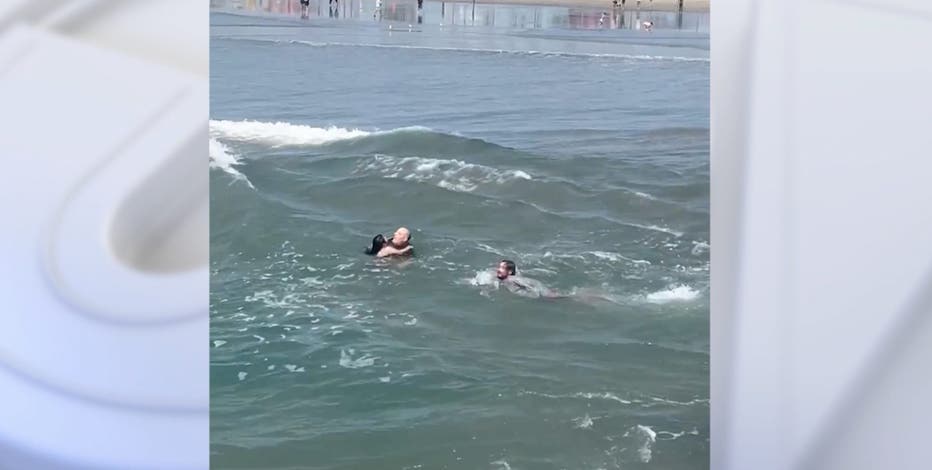 Watch: Surf coach saves father, daughter from rip current in California