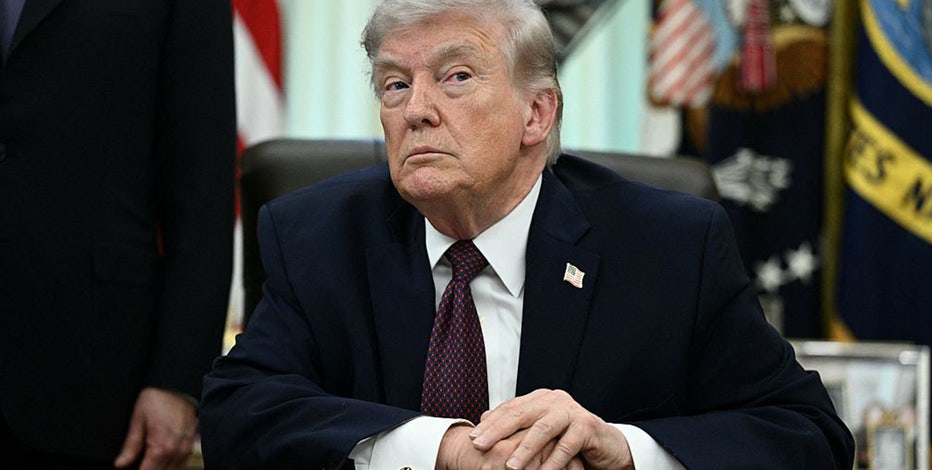Trump signs order aiming to create national voter list, limit mail-in voting