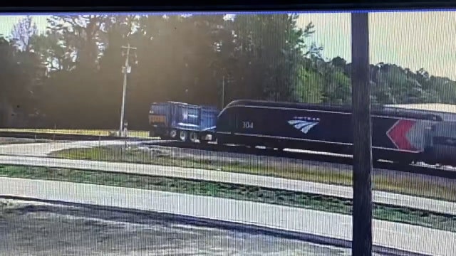 Caught on camera: Amtrak train slams into garbage truck at crossing