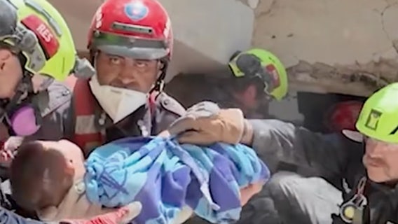WATCH: The moment U.S. rescuers pull a baby from Venezuela ruins