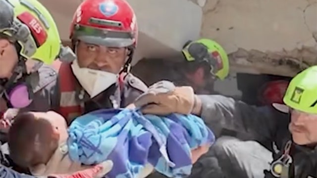 WATCH: The moment U.S. rescuers pull a baby from Venezuela ruins